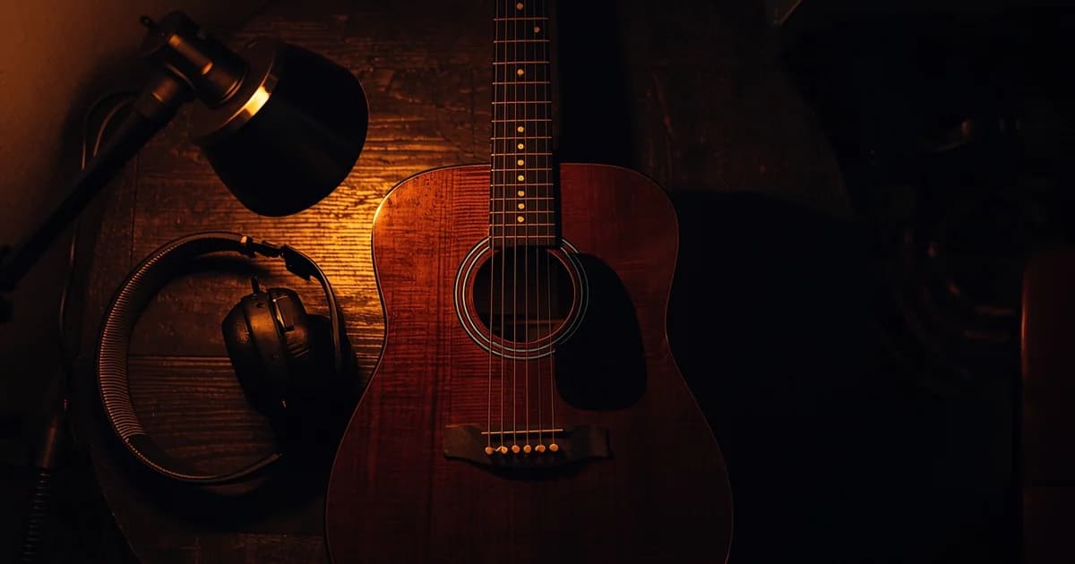 Guitar player practicing with structured routine and tools